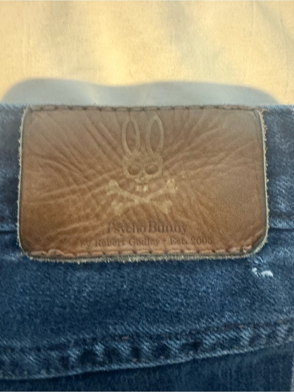 Psycho Bunny Navy Denim Jeans with Red-Accent Flag Patch